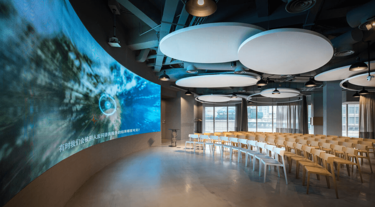 PwC Shanghai auditorium with curved LED screen and modern seating